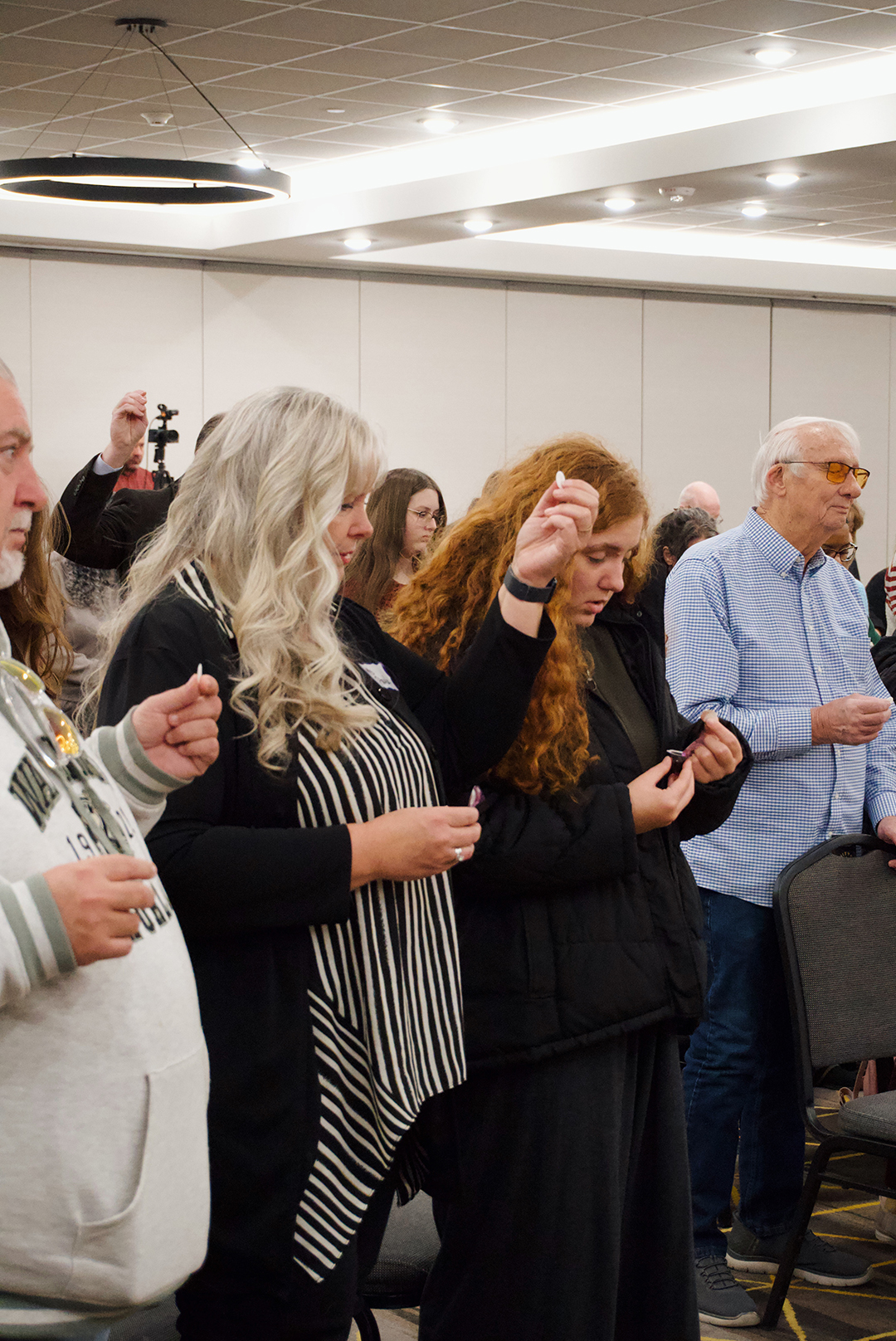 Members of Trinity City Church praying together during a service